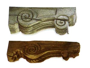136.	Carved corbels. The purlin heads are decorated with scrolls and rope motifs.