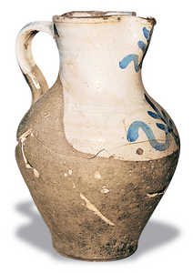 81.	A jug with an enamelled bib. Dishes were extremely limited in the farmhouse.