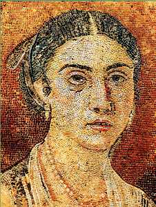 117. This woman of high social status, portrayed in a mosaic, is shown adorned with jewels on her neck and earlobes; the hairstyle was an accompaniment to the lavish dress (see Fig. 78).© Ed. Dolmen