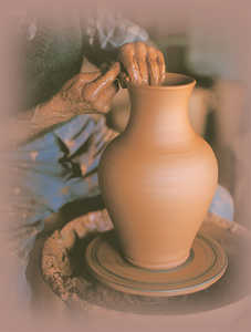 56. A potter shaping a pitcher with a gentle touch.© Jose Lpez